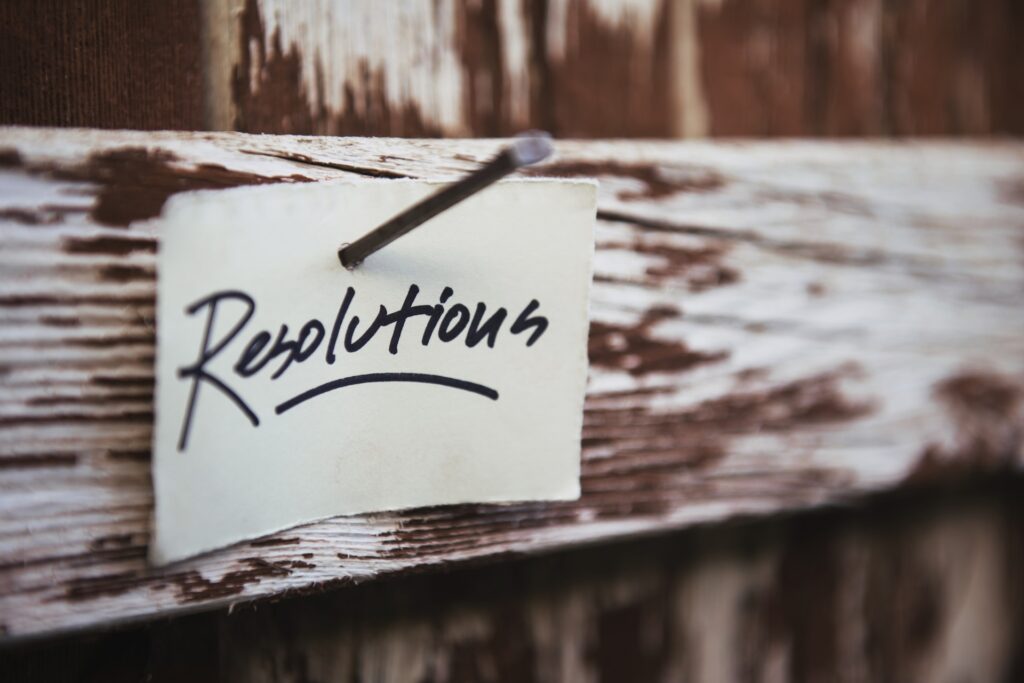 Note stuck to a wooden door