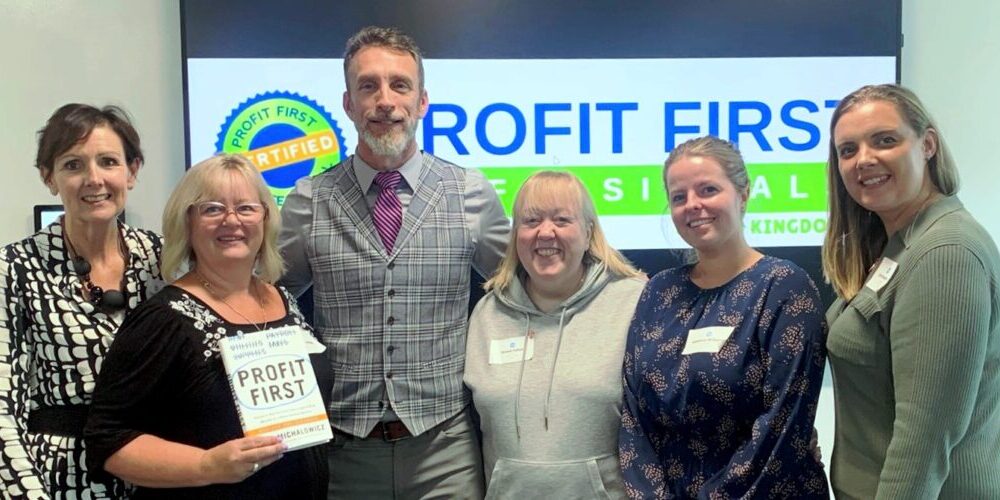 The Accounts Ladies team with Mike Michalowicz, the creator of Profit First